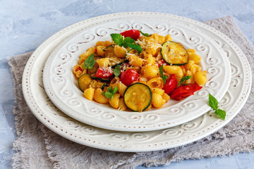 Pasta with cherry tomatoes and zucchini.