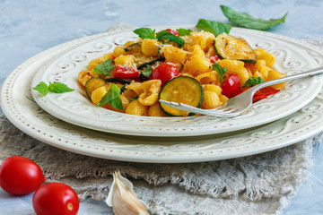 Pasta with zucchini and cherry tomatoes.