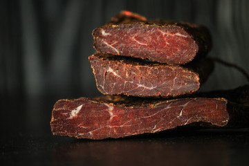 salami cheese-dried smoked sliced ​​slices (sausages) . food background.  Top view with copy space