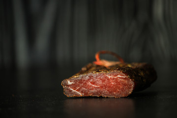 salami cheese-dried smoked sliced ​​slices (sausages) . food background.  Top view with copy space