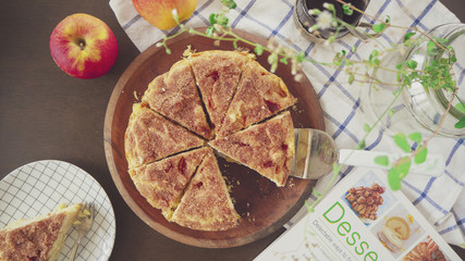 Homemade Apple cake on wooden plate,Top view/OLYMPUS DIGITAL CAMERA