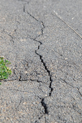 Cracked asphalt floor on a road