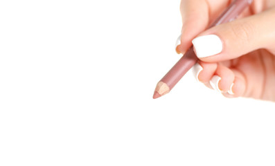 Pencil for lips in hand on white background isolation