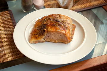 Pork steak on a white plate