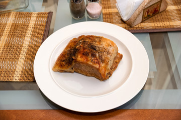 Pork steak on a white plate