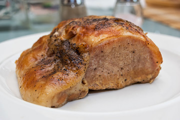 Pork steak on a white plate