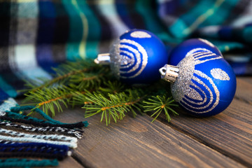 Blue woolen plaid and festive decorations. New Year card