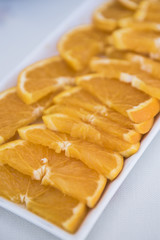 slices of Sicilian oranges are white tray