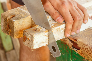 Cutting wooden boards into a hand saw