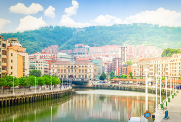 Fototapeta na wymiar view of old town of Bilbao with river Nervion embankment, Spain, retro toned