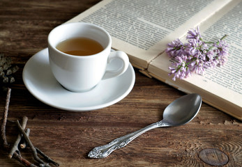 a cup of tea on the board..by the book