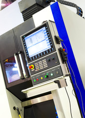 Digitally controlled modern cnc lathe in factory in beautiful, modern, manufactured colors