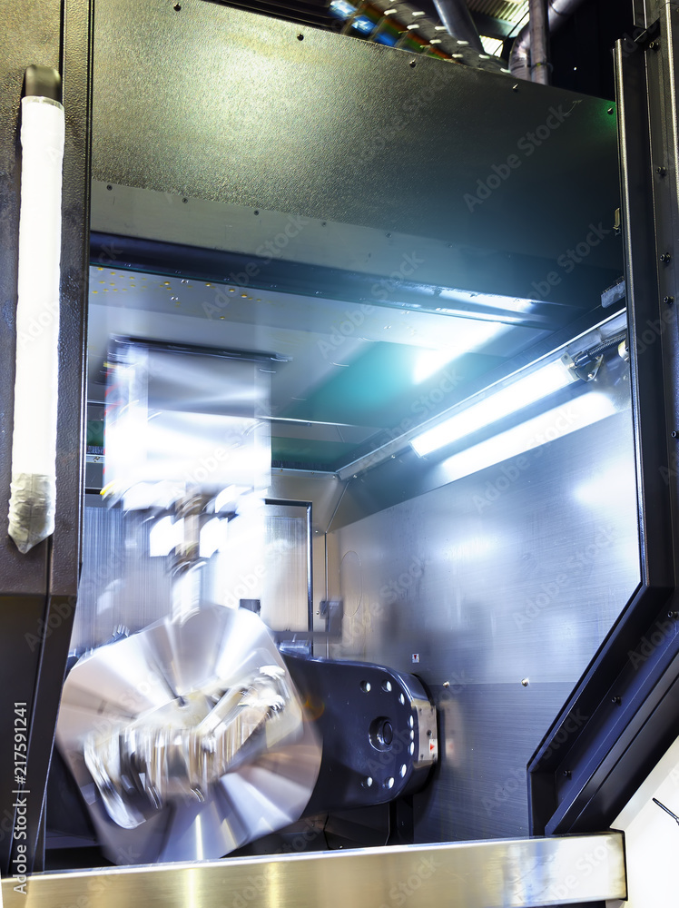 Poster metalworking cnc milling machine. cutting metal modern processing technology. small depth of field. 