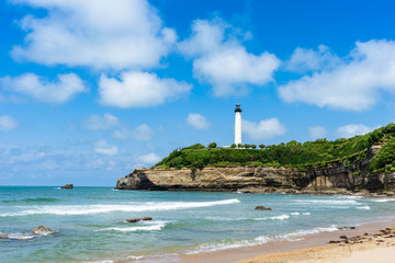 On the beach in Biarritz city with the lighthouse in the background. Basque country of France. - obrazy, fototapety, plakaty