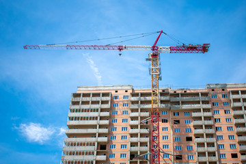 Construction of an apartment building. Construction crane