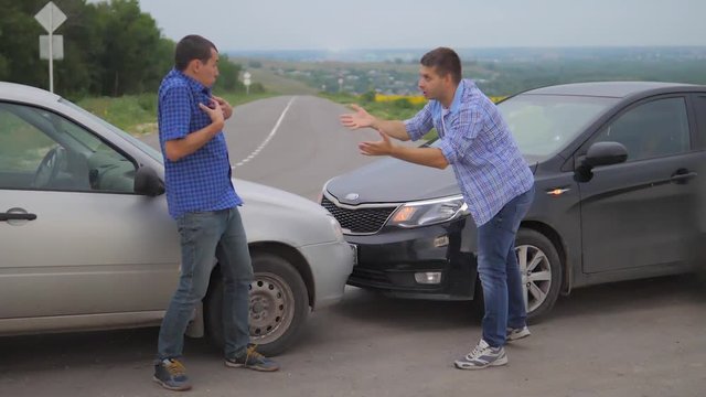 Two men arguing conflict after a car accident on the road car insurance lifestyle. slow motion video. Two Drivers man Arguing After Traffic Accident. auto insurance accident concept men. Two men
