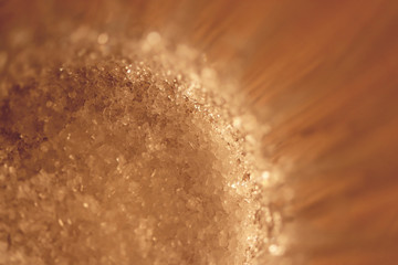 Sugar at the bottom of a faceted glass. Macro closeup artwork.