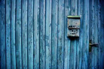 old wooden fence with mailbox
