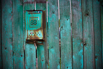 old wooden fence with mailbox