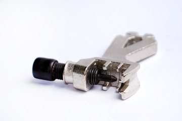 Cycling chain tool isolated on a white background composition