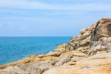 Fototapeta na wymiar Beautiful natural landscape of rock along the coastline with blue sea under the summer sky at Koh Samui island, Surat Thani province, Thailand