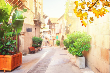Fototapeta na wymiar Poble Espanyol street with sunlight at fall, traditional architecture site in Barcelona, Catalonia Spain