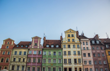 Fototapeta premium soft focus cozy small architecture concept of colorful facades buildings in contrast summer bright day time