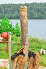 A wooden idol of the Ancient Rus ' surrounded by swords