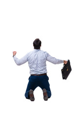 Excited businessman siiting on the knees isolated on white backg