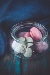 Group of macarons made of strawberries, cream, chocolate and blueberries. Rustic photo.