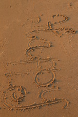 handwrite on sand
