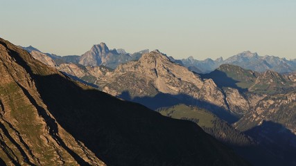Naklejka premium Mountain ranges in the Bernese Oberland at sunrise. Stunning view from Mount Niesen.