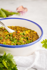 Lentil curry, Indian cuisine, tarka dal, white background. Vegan food.