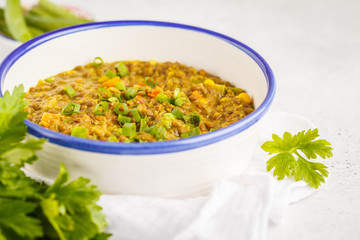Lentil curry, Indian cuisine, tarka dal, white background. Vegan food.