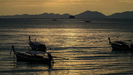 Thai fisherman village boats at sunset