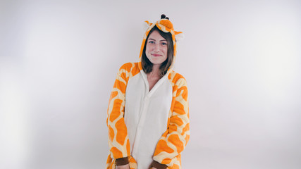 Funny girl in kigurumi pajamas. Emotional portrait of a student. costume presentation of children's...