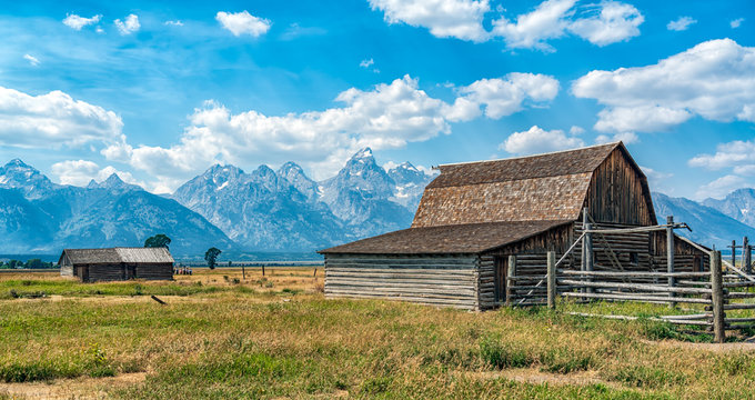 An old barn with the Tetons in the background