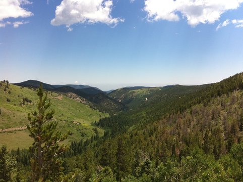Colorado blue sky over mountain valley in Summer