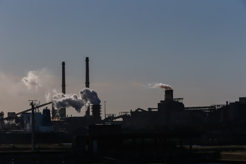 Fototapeta na wymiar Industrial factories and smokestacks