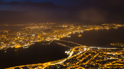 Aerial view of a winter storm approaching the city Tromso, Norway