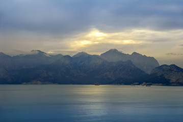 Fototapeta na wymiar Antalya, Turkey, 19 December 2010: Gulf of Antalya with clouds and sunset