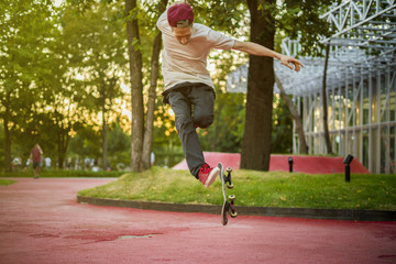young male skateboard rider jumping and doing tricks