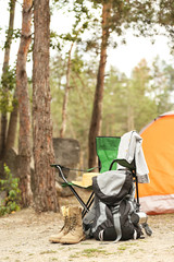 Set of camping equipment outdoors on summer day