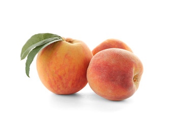 Fresh sweet peaches on white background