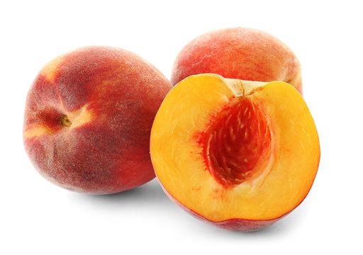 Fresh sweet peaches on white background