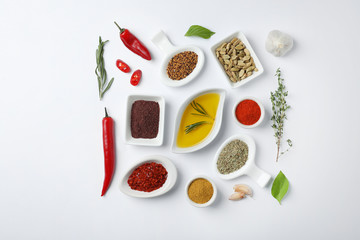 Composition with different aromatic spices on white background, top view © New Africa