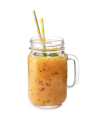 Tasty peach smoothie in mason jar on white background
