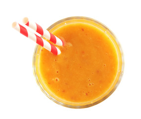 Tasty peach smoothie in glass on white, top view