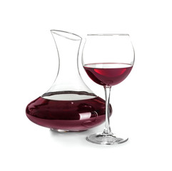 Elegant decanter and glass with red wine on white background
