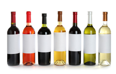 Bottles with different wine on white background